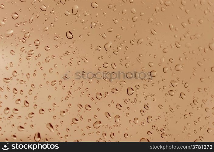 Drops of water. Water droplets on the glass with a colored background. Drops of water.