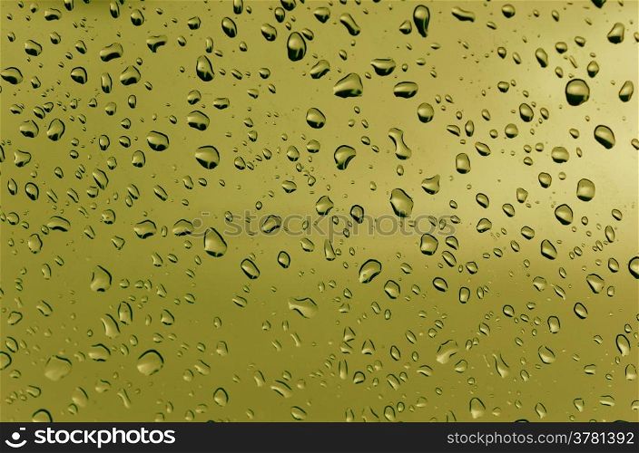 Drops of water. Water droplets on the glass with a colored background. Drops of water.