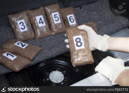 Drug bundles smuggled in a car trunk