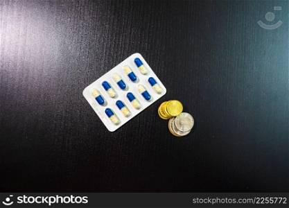 Drug capsule pills, medicine and vitamins on the table