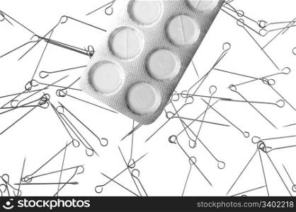 Drugs and needles on white background- metaphor of drug addiction