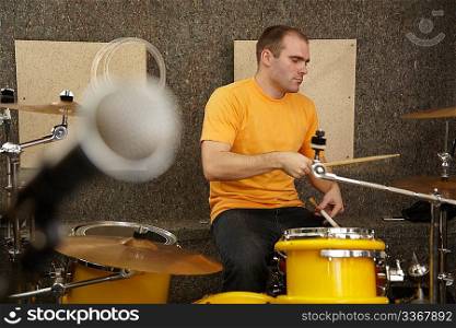 drummer near drumkit. microphone in out of focus