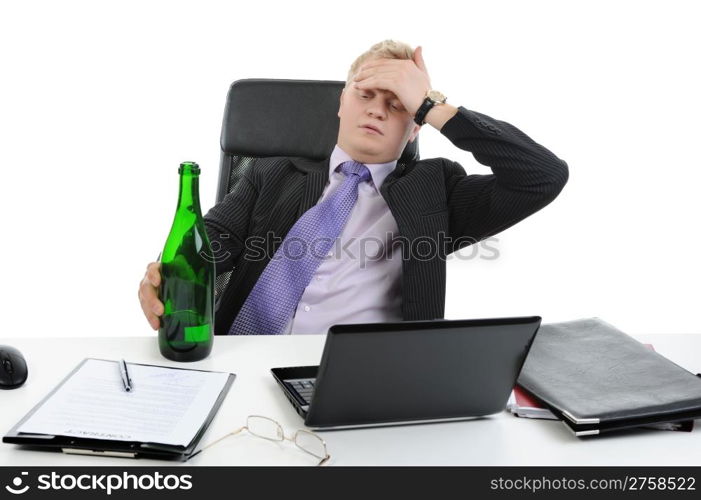 Drunk businessman drinking champagne on the job in the office. Isolated on white background