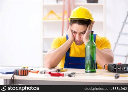 Drunk engineer working in the workshop