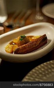 Dry aged duck breast with potato croquet, Beautiful and tasty food on a plate, exquisite dish, creative restaurant meal concept . Dry aged duck breast with potato croquet