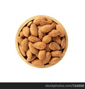 Dry almonds in wooden bowl isolated on white background, top view on wooden. Healthy food concept