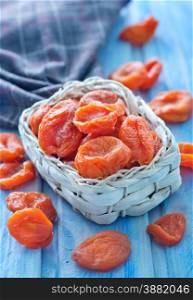 dry apricot in bowl and on a table