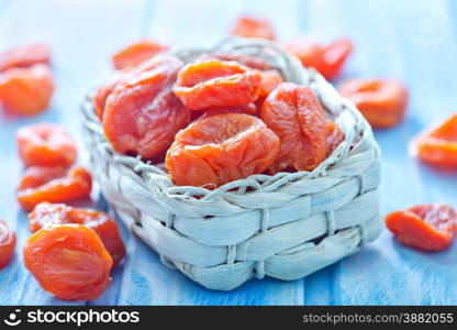 dry apricot in bowl and on a table