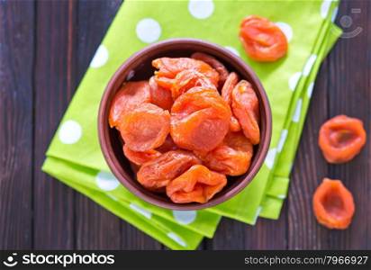 dry apricot in bowl and on a table