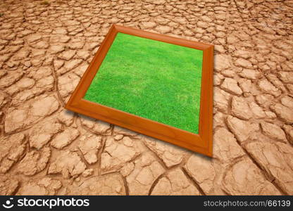 Dry cracked earth background and green grass picture