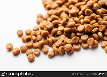 Dry feed pellets  for dogs on a white background. Healthy food for dogs
