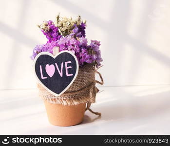 Dry flowers in the flower pot for valentines day