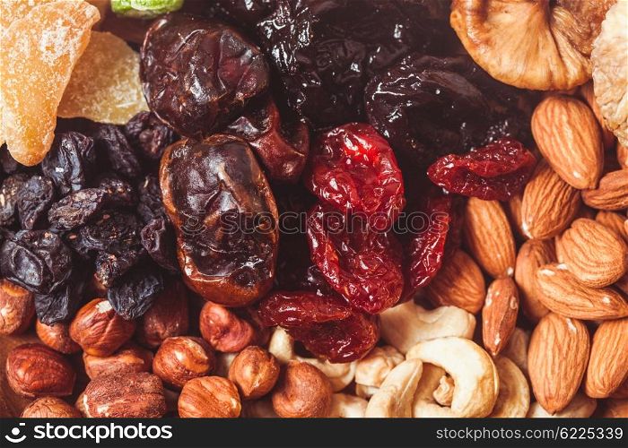 Dry fruits and nuts background - close up healthy sweets. Dry fruits and nuts