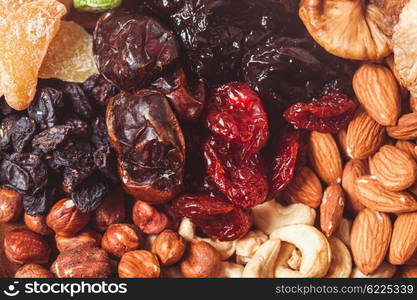 Dry fruits and nuts background - close up healthy sweets. Dry fruits and nuts