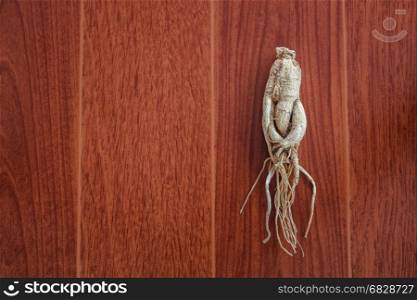 Dry Ginseng on the wood.