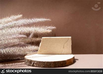 dry grass styled stock scene in brown earth tones, travertine podium display with copy space. Ch&agne and grass styled stock scene