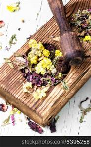Dry herb tea. Herbal medicinal flowers tea in a mortar with a pestle