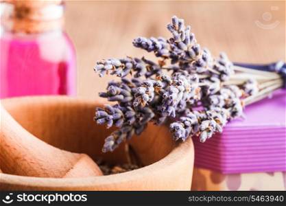Dry lavender bunch and wooden mortar, preparation