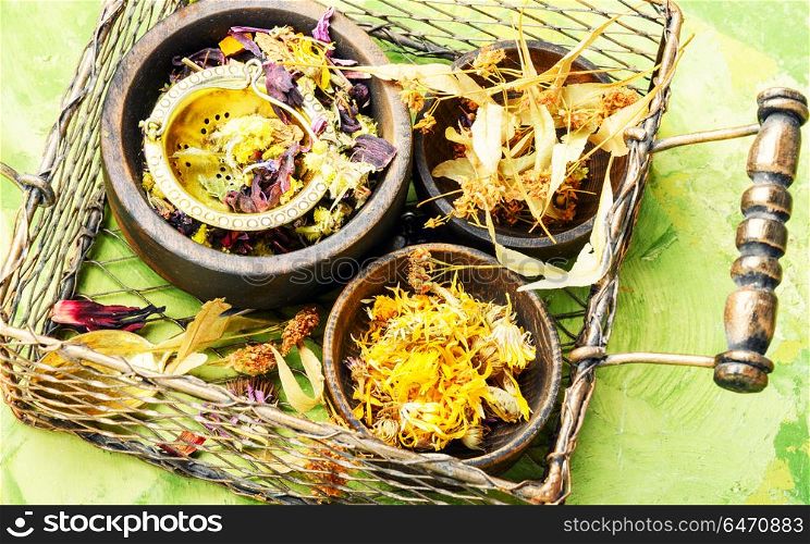 Dry leaf tea. Herbal floral tea with mortar in a stylish basket