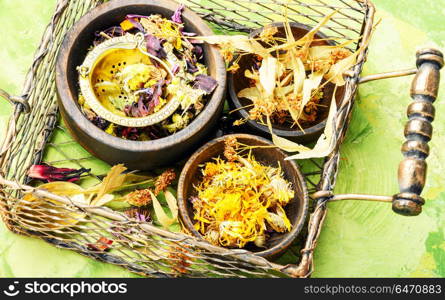 Dry leaf tea. Herbal floral tea with mortar in a stylish basket