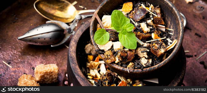 dry leaves of fruit tea. fruit tea leaf in a wooden bowl