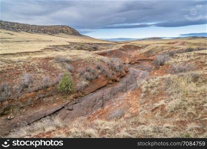 dry Park Creek and prairie at northern Colorado foothills, early spring scenery