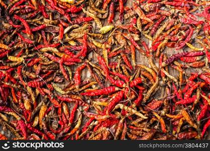 Dry red hot chili peppers at asian market. Organic food background