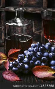 Dry red wine. Young red wine in the glass from the autumn harvest of grapes.Dark key