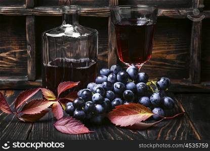 Dry red wine. Young red wine in the glass from the autumn harvest of grapes.Dark key
