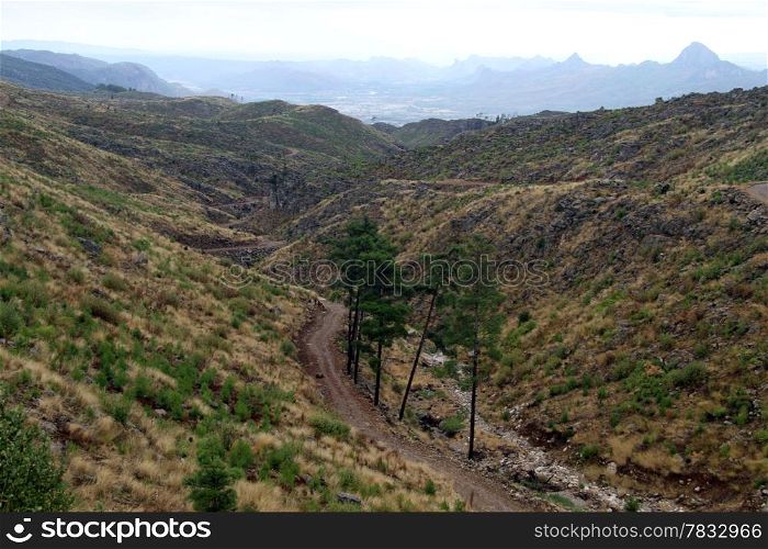 Dry river bed and road in mountain area, Turkey