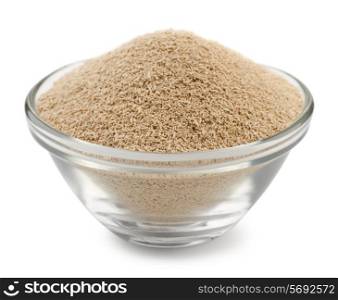 Dry yeast granules in glass bowl isolated on white