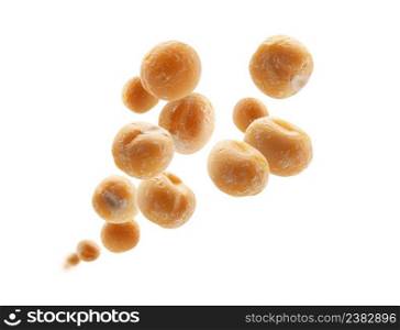 Dry yellow peas levitate on a white background.. Dry yellow peas levitate on a white background