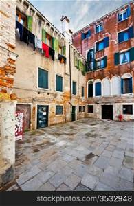 Drying Clothes, Bulletin Board and Graffiti in the Courtyard of the Venetian House