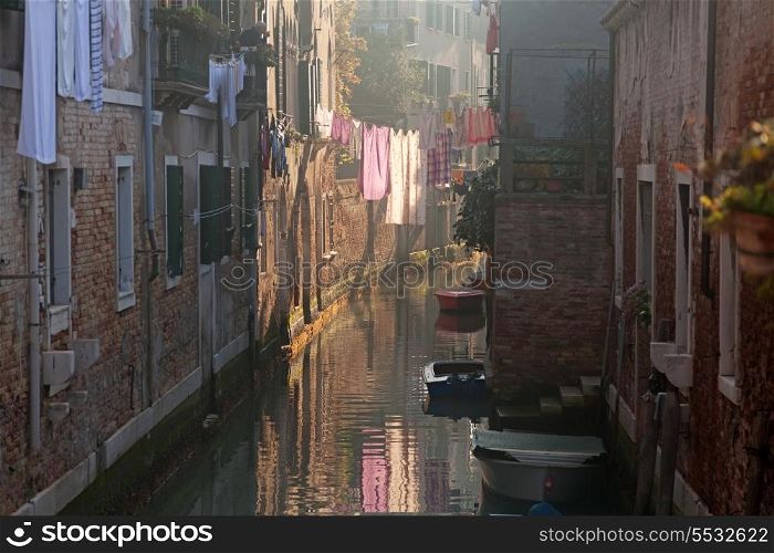 Drying clothes on the rope across venetian channel