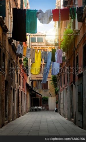 Drying clothes on venetian street at sunny day, Italy