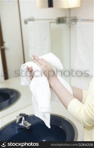 Drying hands with towel