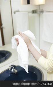 Drying hands with towel