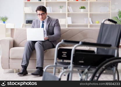 Dsabled businessman on wheelchair working home. Disabled businessman on wheelchair working home