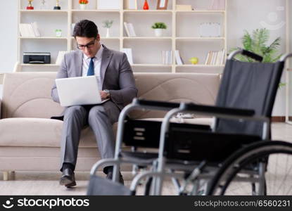 Dsabled businessman on wheelchair working home. Disabled businessman on wheelchair working home