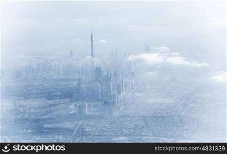 Dubai downtown in fog, beautiful misty cityscape, bad weather on luxury resort, UAE, vacation and travel concept