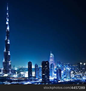 Dubai downtown night scene with city lights, luxury new high tech town in middle East, United Arab Emirates architecture