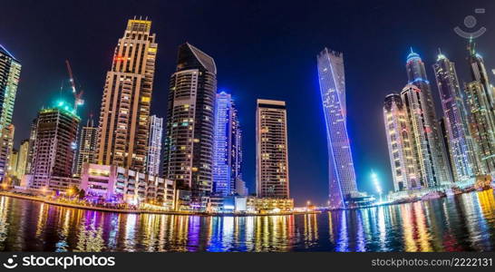 Dubai downtown night scene with city lights, luxury new high tech town in middle East. Dubai Marina cityscape, UAE.