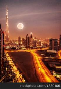 Dubai in moonlight, UAE, full moon, night scape in Dubai downtown, modern arabian architecture, middle east, illuminated city at night, luxury vacation