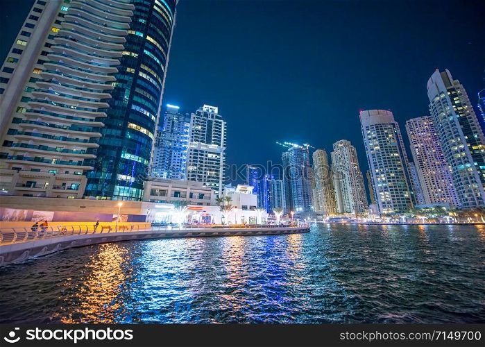 Dubai Marina night skyline. Buildings and river, United Arab Emirates.