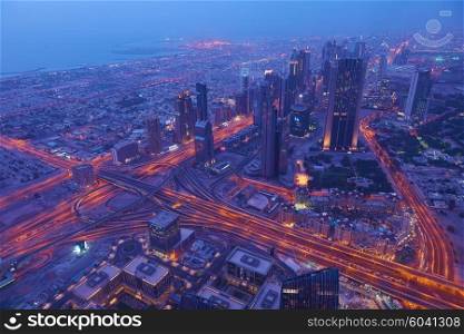 Dubai night skyline. Dubai streets by night. Al Yaqoub tower Dubai. Dubai Millennium Plaza. Dubai Sheikh Zayed Road by night. Dubai night view. Dubai cityscape by night. Dubai metro station view.