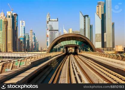 Dubai's Metro with skyscrapers is leaving the metro station