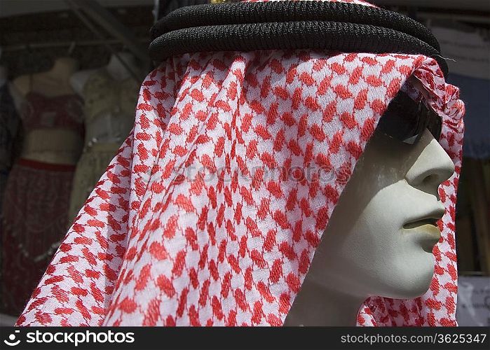 Dubai, UAE, A mannequin is dressed in a traditional men s gutra, headdress.