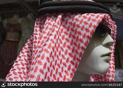 Dubai, UAE, A mannequin is dressed in a traditional men s gutra, headdress.