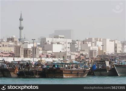 Dubai, UAE, Dhows, old wooden sailing vessels, are docked along the Deira side of Dubai Creek.