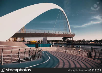 DUBAI, UAE - FEBRUARY, 2018  Dubai Water Canal arch bridge or Tolerance bridge